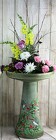 Colorful Birds on a Bird Bath with flower arrangement from Flowers by Ray and Sharon in Muskegon, MI