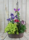 Perennial Garden in a Metal Tub with a Wind Chime from Flowers by Ray and Sharon in Muskegon, MI