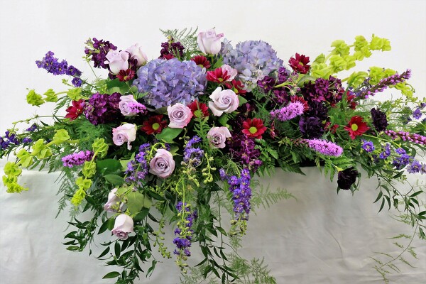 GARDEN TRIBUTE CASKET SPRAY from Flowers by Ray and Sharon in Muskegon, MI